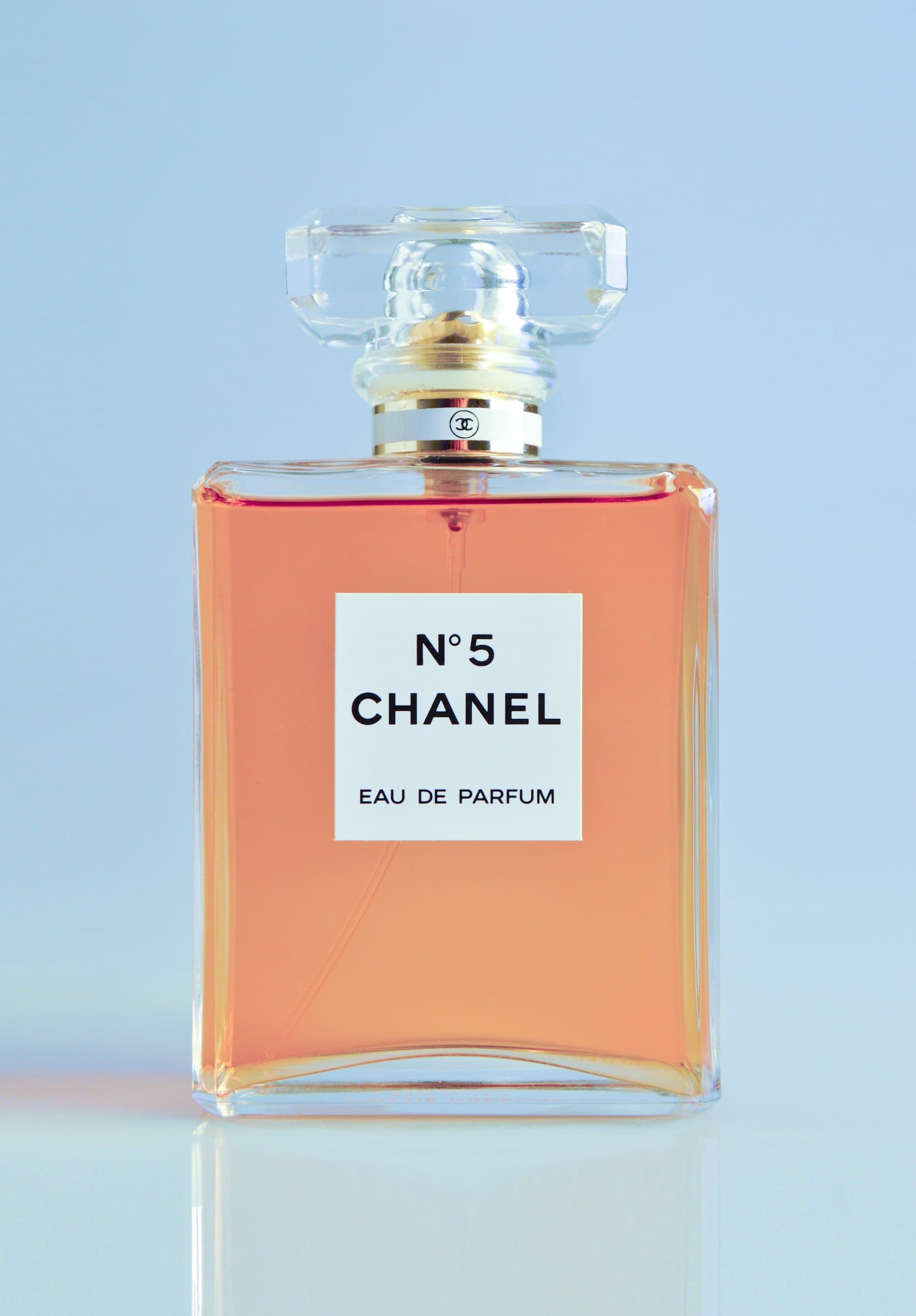 Placeholder photograph of a dark perfume bottle